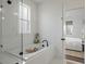 Serene bathroom featuring soaking tub, subway tile and glass shower door at 1474 Mizzen Aly, Johns Island, SC 29455