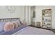 Bright bedroom features hardwood floors, decorative shelving and peace symbol wall decor at 1474 Mizzen Aly, Johns Island, SC 29455