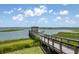 Picturesque dock extending into the serene waterway with a charming gazebo at the end at 1474 Mizzen Aly, Johns Island, SC 29455