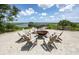 Inviting outdoor fire pit area surrounded by Adirondack chairs, perfect for gatherings by the water at 1474 Mizzen Aly, Johns Island, SC 29455