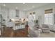 Open kitchen with white cabinets, granite countertops, and a kitchen island at 1474 Mizzen Aly, Johns Island, SC 29455