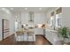 Well-equipped kitchen with granite countertops, white cabinets, and stainless steel appliances at 1474 Mizzen Aly, Johns Island, SC 29455