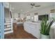 Open floor plan features a living room with fireplace adjacent to kitchen with bar seating at 1474 Mizzen Aly, Johns Island, SC 29455