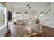 Bright living room featuring a sectional sofa, ceiling fan, and hardwood floors at 1474 Mizzen Aly, Johns Island, SC 29455