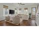 Comfortable living area featuring hardwood floors, large sectional sofa, and ample natural light at 1474 Mizzen Aly, Johns Island, SC 29455
