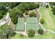 Aerial view of tennis and pickleball courts amidst manicured green spaces and mature trees at 1474 Mizzen Aly, Johns Island, SC 29455