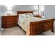 Bedroom with wooden sleigh bed, and plenty of storage at 1625 Live Oak Park, Seabrook Island, SC 29455