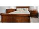 Bedroom with wooden sleigh bed, and plenty of storage at 1625 Live Oak Park, Seabrook Island, SC 29455