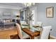 Bright dining area with glass-top table and seating for four, adjacent to living room at 1625 Live Oak Park, Seabrook Island, SC 29455