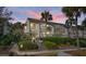 Attractive two-story condo building with balconies, landscaping, and walkway at 1625 Live Oak Park, Seabrook Island, SC 29455