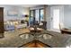 Kitchen with granite island, double sink, and views into living and dining areas at 1625 Live Oak Park, Seabrook Island, SC 29455