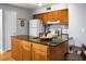 Cozy kitchen with wood cabinets, granite counters and modern appliances at 1625 Live Oak Park, Seabrook Island, SC 29455