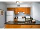 Cozy kitchen with wood cabinets, granite counters and modern appliances at 1625 Live Oak Park, Seabrook Island, SC 29455