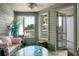 Sunroom with wicker furniture and water views at 1625 Live Oak Park, Seabrook Island, SC 29455