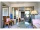 Bright sunroom with glass doors and wicker furniture at 1625 Live Oak Park, Seabrook Island, SC 29455