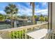 Deck overlooks tennis courts and lush landscape at 1625 Live Oak Park, Seabrook Island, SC 29455