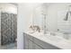 Clean bathroom with gray vanity and patterned shower curtain at 1680 Banning St, Mount Pleasant, SC 29466