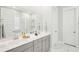 Elegant bathroom with double vanity, a large mirror, and a walk-in shower at 1680 Banning St, Mount Pleasant, SC 29466