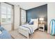 Serene bedroom with white bed, blue accents, and a surfboard at 1680 Banning St, Mount Pleasant, SC 29466