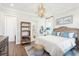 Bright bedroom with a cozy bed, en-suite bathroom access, and built-in shelving at 1680 Banning St, Mount Pleasant, SC 29466
