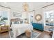 Spacious bedroom with wood flooring, a comfy bed, and stylish decor at 1680 Banning St, Mount Pleasant, SC 29466