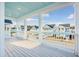 White deck overlooking a charming neighborhood with white houses at 1680 Banning St, Mount Pleasant, SC 29466