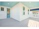 White deck with light blue ceiling, white railings, and a view of neighborhood at 1680 Banning St, Mount Pleasant, SC 29466