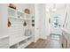 White entryway with built-in bench and storage at 1680 Banning St, Mount Pleasant, SC 29466