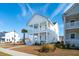 Two-story white house with a front porch and palm tree at 1680 Banning St, Mount Pleasant, SC 29466