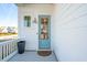Light blue front door with a welcome sign at 1680 Banning St, Mount Pleasant, SC 29466
