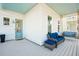 Front porch with blue couch and a light blue door at 1680 Banning St, Mount Pleasant, SC 29466