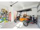 Garage with golf cart, storage shelves, and a small bathroom at 1680 Banning St, Mount Pleasant, SC 29466