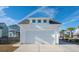 White detached garage with white door and landscaping at 1680 Banning St, Mount Pleasant, SC 29466