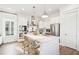 Open concept kitchen with white cabinets and large island at 1680 Banning St, Mount Pleasant, SC 29466