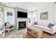 Cozy living room with fireplace, light-colored sofa, and a TV at 1680 Banning St, Mount Pleasant, SC 29466