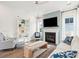 Spacious living area with fireplace, built-in shelving, and large windows at 1680 Banning St, Mount Pleasant, SC 29466
