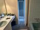 Bathroom with blue tile and a large vanity at 19 Fort Royal Ave, Charleston, SC 29407