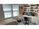 Bright bedroom with built-in shelving and a workspace at 19 Fort Royal Ave, Charleston, SC 29407