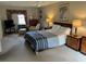 Spacious bedroom with large bed, sitting area, and ample light at 19 Fort Royal Ave, Charleston, SC 29407
