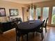 Elegant dining room featuring an oval table, access to backyard, hardwood floors at 19 Fort Royal Ave, Charleston, SC 29407