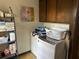 Laundry room with washer, dryer, cabinets, and shelving at 19 Fort Royal Ave, Charleston, SC 29407