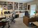 Home office with built-in bookshelves and two desks at 19 Fort Royal Ave, Charleston, SC 29407