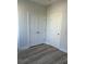 Spacious bedroom with double closets and wood-look floors at 2023 Comstock Ave, North Charleston, SC 29405