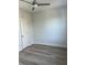 Bright bedroom with ceiling fan and grey wood-look flooring at 2023 Comstock Ave, North Charleston, SC 29405