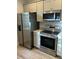 Modern kitchen with stainless steel appliances and light cabinets at 2023 Comstock Ave, North Charleston, SC 29405