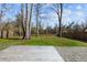 Large backyard with grassy area, wooden deck, and privacy fence at 2035 Culloden Dr, Summerville, SC 29483