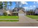 Two-story house with a driveway, front porch and a nicely landscaped yard at 2035 Culloden Dr, Summerville, SC 29483