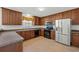 Modern kitchen with stainless steel appliances and wood cabinets at 2035 Culloden Dr, Summerville, SC 29483
