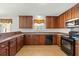 Modern kitchen with stainless steel appliances and wood cabinets at 2035 Culloden Dr, Summerville, SC 29483