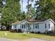 Charming one-story home with gray siding, landscaping, and a spacious yard at 206 Dukes St, Saint George, SC 29477